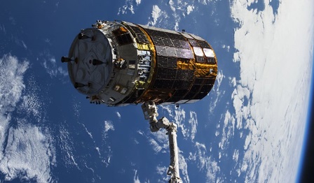 Image of a spacecraft module attached to a 700 m long electro-dynamic tether that will drag the spacecraft towards Earth.