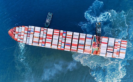 Aerial top view Tug boat drag container ship to sea port for unloading container