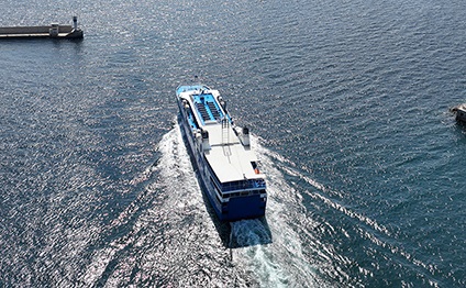 high speed Seajet passenger vessel leaving port of Piraeus to Aegean Cycladic island destination