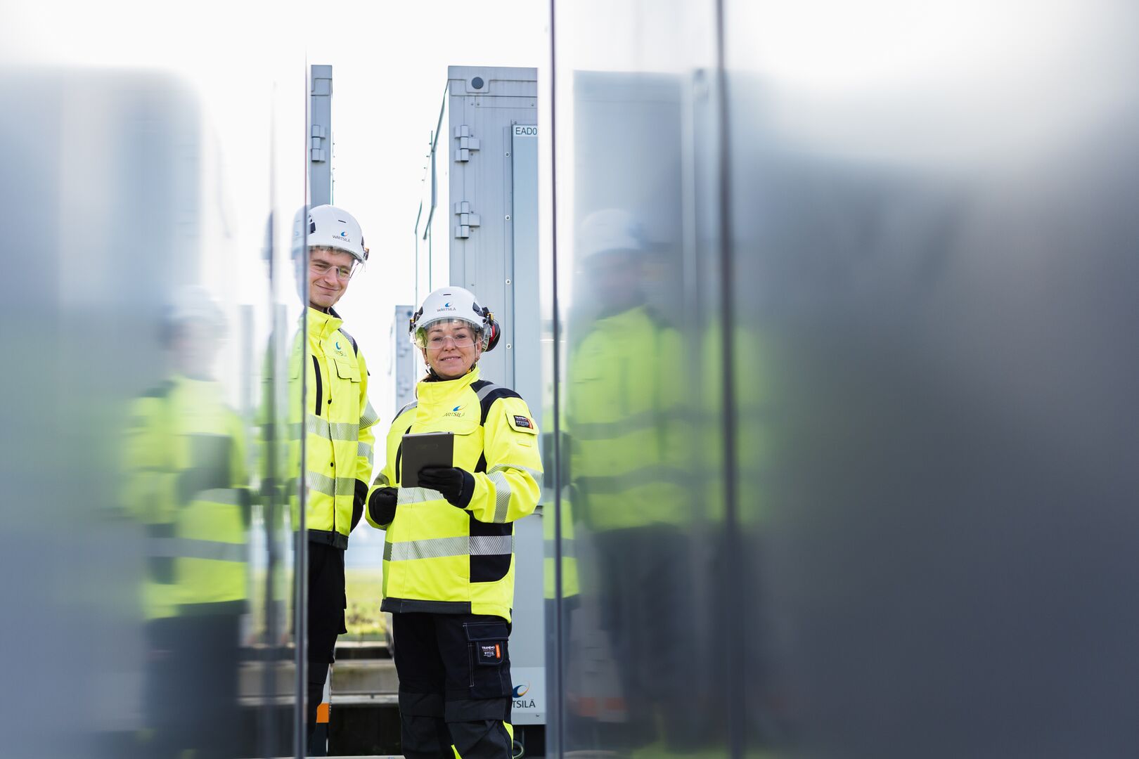 Engineers standing outside plant - Giga storage-6