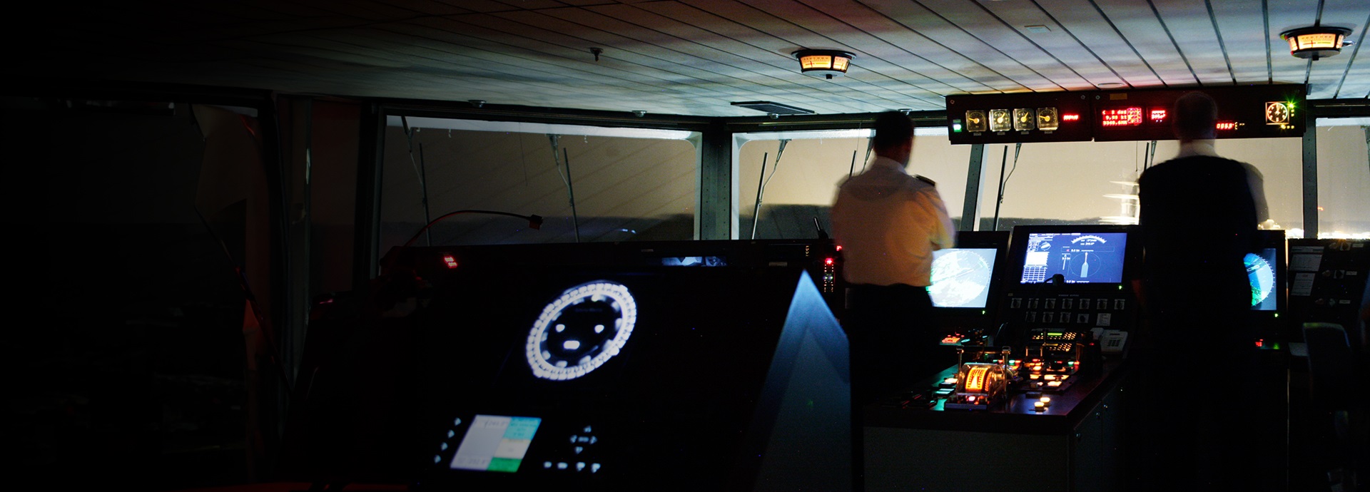 People on a bridge of a vessel
