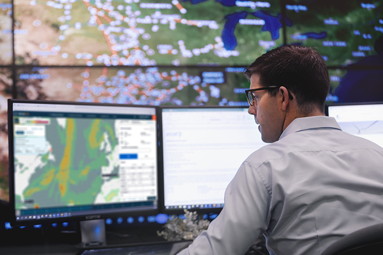 Wärtsilä employee sitting in front of a monitor