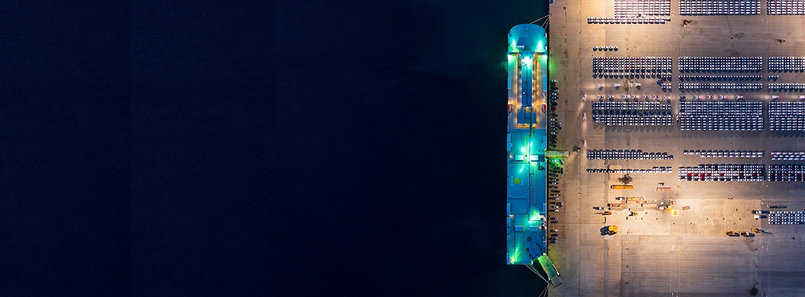 a night-time image of a car carrier vessel