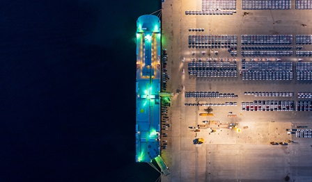 a night-time image of a car carrier vessel