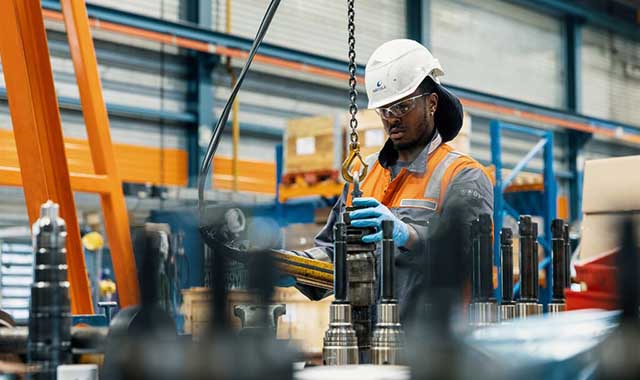 service employee operating a machine