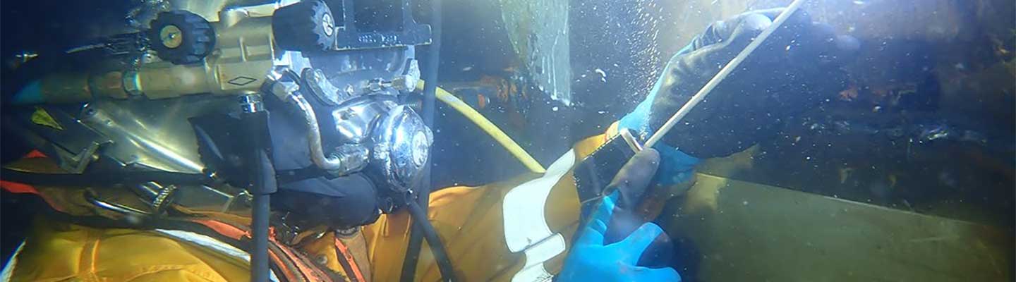 Diver completing a scrubber pipe repair