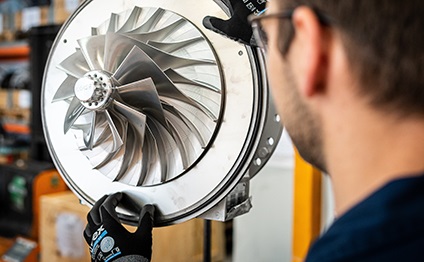 Wärtsilä service employee working on a turbocharger